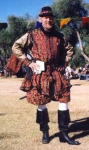 Photo showing a full silk and brocade suit I made long ago for this client. The has a simple slop hose with a silk doublet. The outer layer is an Alcega jerkin rather than a cassock...see? its hard to tell when you cant see the particulars.