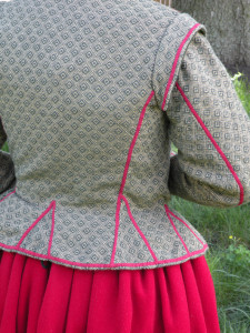 At the turn of the century, jackets like this one sat at the natural waist. As the 1600s became the 1610s and 1620s, the waistline rose to mid-rib.