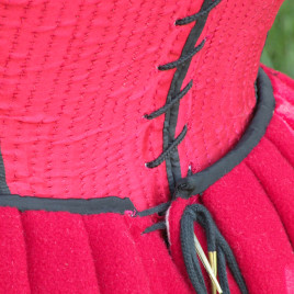 point laces through two holes on either side of the petticoat's back opening. This allows for considerable adjustability. Also, when the laces are tied together after being threaded through both sets of holes, they stay laced remarkably well--it takes work to loosen the hitch.